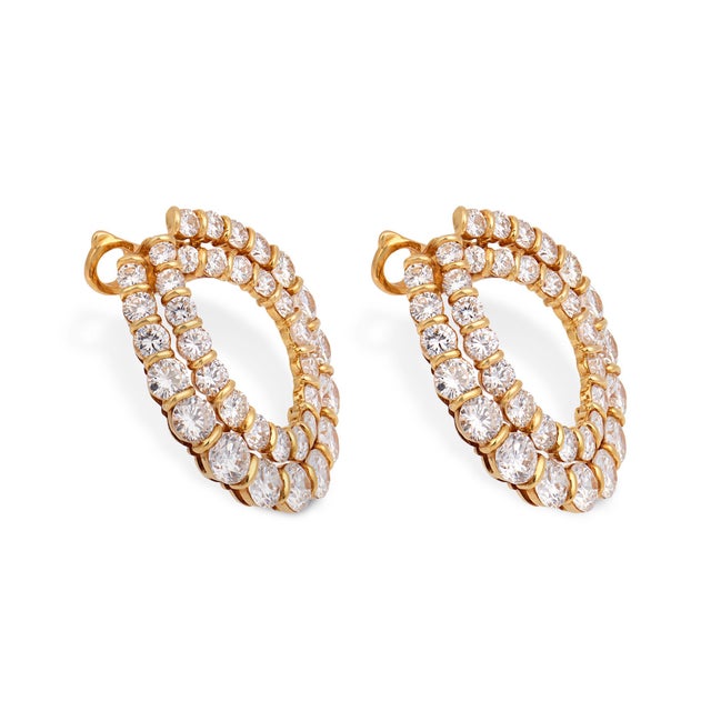These exceptional vintage hoop earrings by Boucheron Paris embody bold luxury and refined craftsmanship, set with an...
