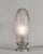 Simonet frères & Dieupart A beautiful French 1925-1930 art deco lamp in nickel plated solid brass or bronze holding a...