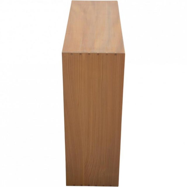 Mogens Koch bookcase made of elm, and from the 1970s. The bookcase appears in good condition with a few marks and...