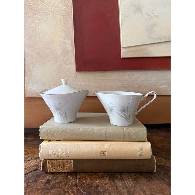 Complete your table with this elegant Hutschenreuther Caribe creamer and covered sugar bowl set. Crafted in Germany from...
