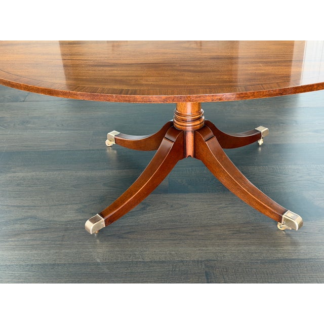 Oval mahogany coffee table features beautiful banding around a center of polished mahogany. The oval shaped top allows for...
