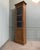 This spectacular glazed cabinet in solid oak is a former clock case transformed into a storage unit. Standing 2.30 m tall,...