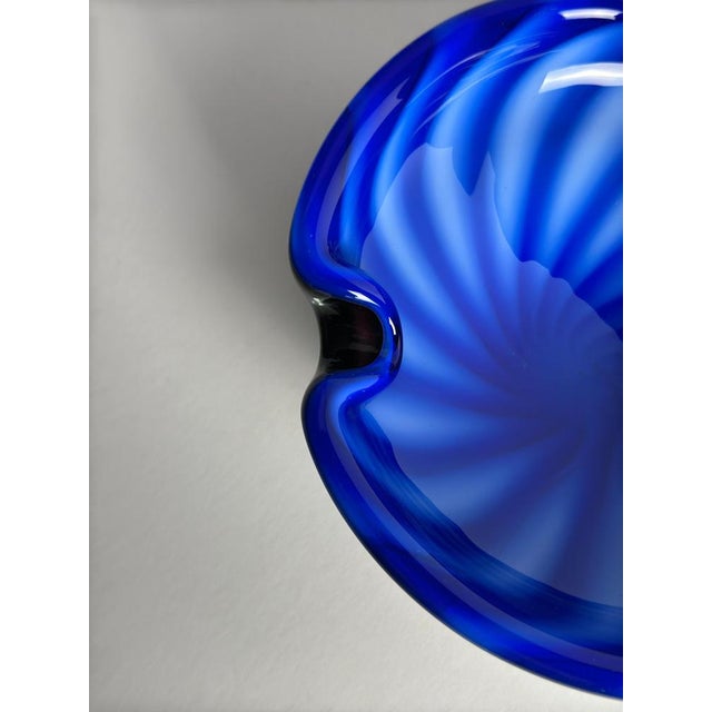 This Murano glass bowl by Alfredo Barbini, produced in Italy circa the 1970s, is executed in the sommerso technique,...