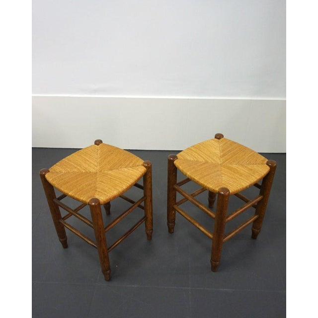 Pair of rush and wood stools. France, 1960s. In very good condition.