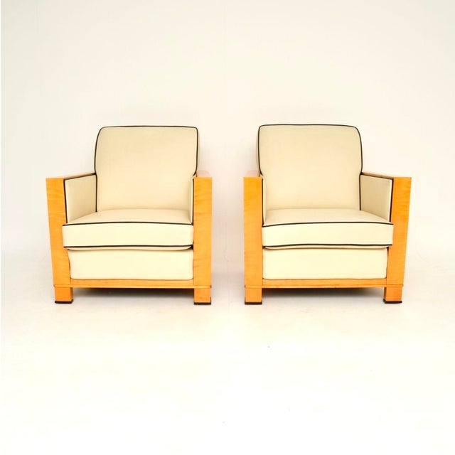 A very stylish and extremely well made pair of Swedish Art Deco armchairs in leather and satin birch. They were recently...