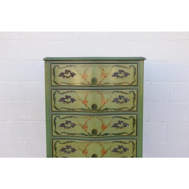 Charming vintage French Provincial style tall chest of drawers, circa 1950s, crafted from solid wood and featuring a...