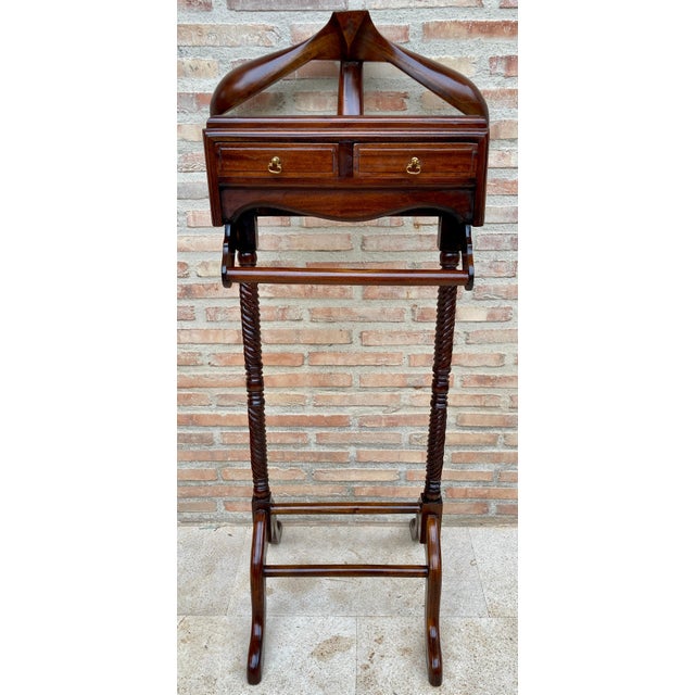 Vintage mid-century gentlemen's valet. Dark walnut and features shelf for cuff links or jewelry and bars for hanging...