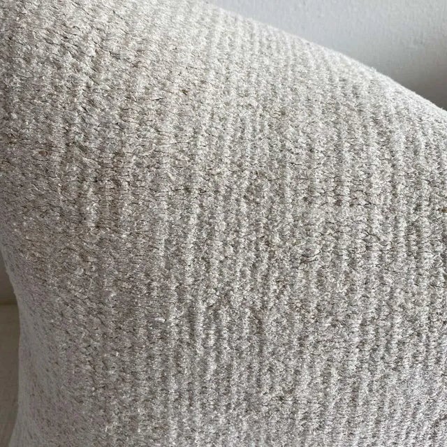 Unique pillow has been made with a Turkish rug, in multiple white tones, and some variations of white woven through. The...