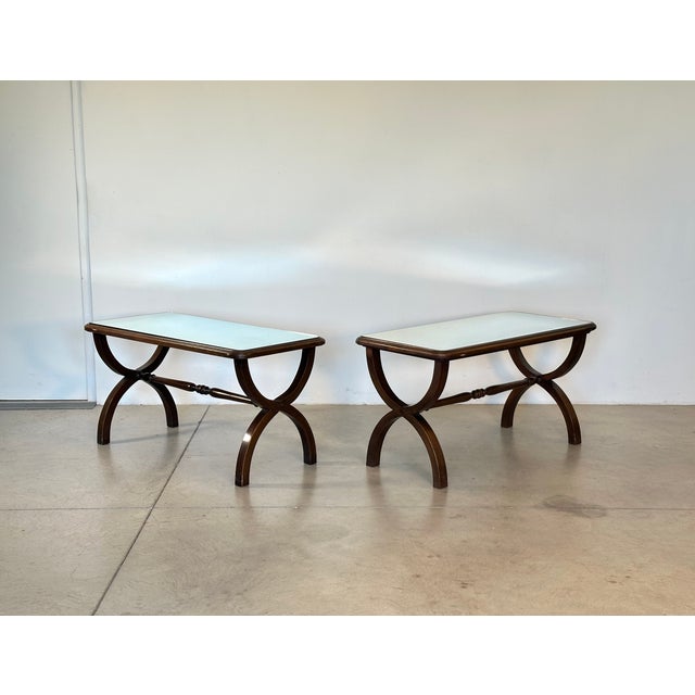 Pair of 1960s coffee tables, neoclassical style, stained beech wood and mirror top
