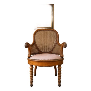 Antique Victorian Cane Back Armchair With Carved Wood Frame and Upholstered Seat For Sale