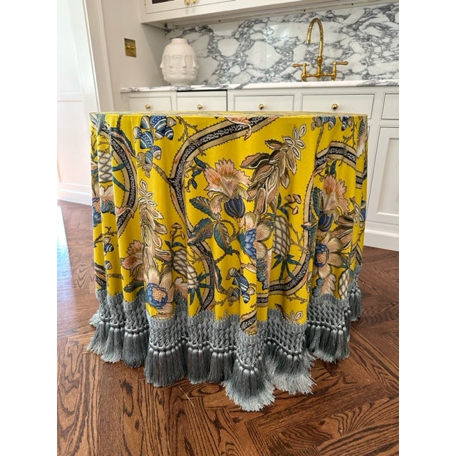A gorgeous custom table skirted in “A la Table du roi” in canari by Pierre Frey with 8” Rouen tassel fringe by Samuel &...