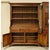 Crafted in a traditional style, this piece features a warm wood finish, paneled cabinet doors, and a substantial crown-...