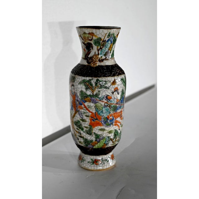 Vase in cracked earthenware from the Chinese region of Nanjing with a monogram under the base. The cylindrical body is...