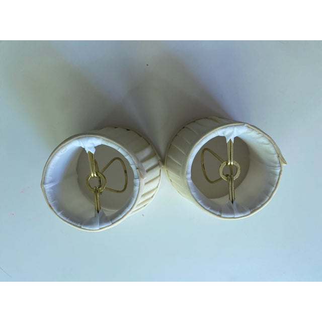 Handmade silk lampshades with 1/2 wide touching box pleats and self-welt trim in off-white silk. Candelabra clips. 2 1/2"...