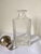 This an elegant whiskey crystal bottle.The crystal stopper is coated in silver. The surface in silver shows the signs of...