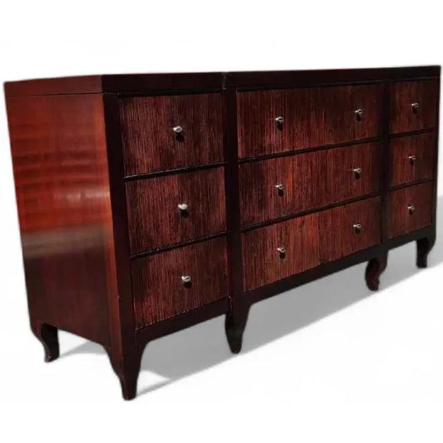 This Barbara Barry for Baker Furniture – Modern Regency Reeded Mahogany Triple Dresser embodies luxury and modern elegance...