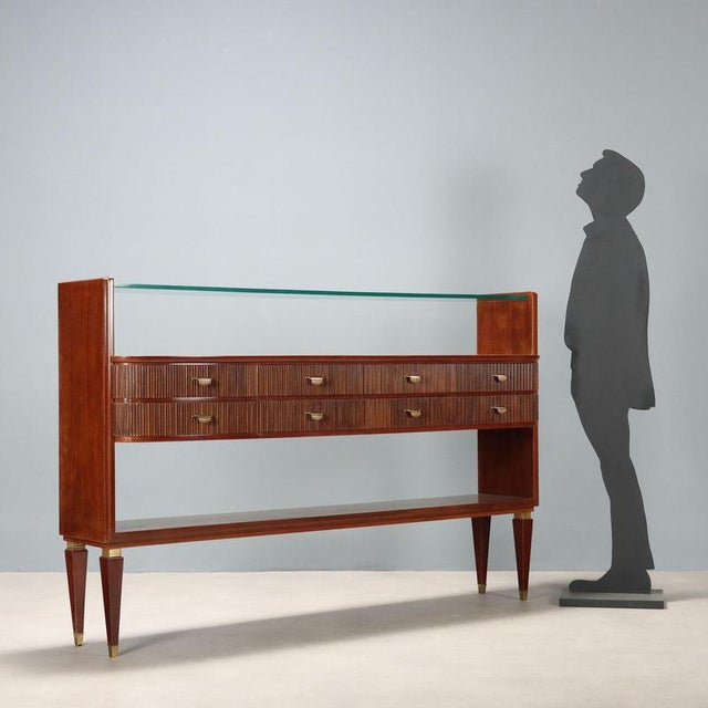 Elegant living room furniture of high Italian craftsmanship in exotic wood veneer with a thick glass top, eight central...