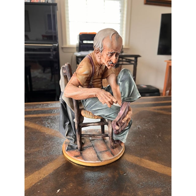 Selling this vintage Capodimonte Man Mending Sock Figurine. Made in Italy. Dimensions: 9.5 inches tall About 7 wide About...