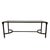 A Neoclassical coffee table crafted with a dark metal frame and clear glass top. The narrow rectangular tabletop is...