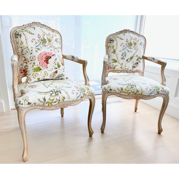 Design Plus Gallery presents a Pair of Floral Upholstery Armchairs in the Louis XV-Style with Matching Lumbar Pillow. The...