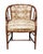 This Regency-style barrel chair features a rich brown faux bamboo frame. The rounded back and arms provide a comfortable...