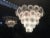 Spectacular pair chandelier by Vistosi, each made of 50 Murano discs put on five floors. Nine E14 light bulbs. This piece...