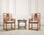 An organic and elaborately crafted pair of 20th century Chinese Export hardwood scholar's armchairs crafted in the Ming...