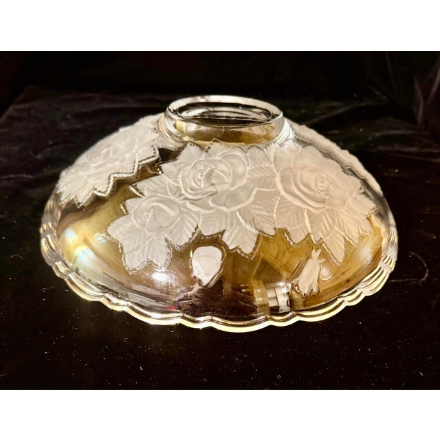This bowl is a versatile piece used as a centerpiece, salad bowl, or fruit dish. It is known for its elegant scalloped rim...