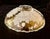 This bowl is a versatile piece used as a centerpiece, salad bowl, or fruit dish. It is known for its elegant scalloped rim...