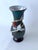 Iridescent black glass vase in an art nouveau hand-formed glass floral decor in the style of Loutz. You can say of vase...