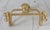 Vintage brass toilet paper holder. No makers mark. Some age wear to finish. Includes hardware.