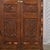 Antique Indian Carved Teakwood, Marquetry, and Painted on Glass Panels Armoire, c. 1900-30. In richly patinated teak, with...