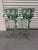 A dramatic pair of verdigris wrought iron plant stands, featuring a floral and leaf motif with dangling rosettes. Standing...