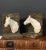 Charming vintage cast iron bookends, 1930’s. Painted horse heads extend outward in opposite direction. Great for a touch...