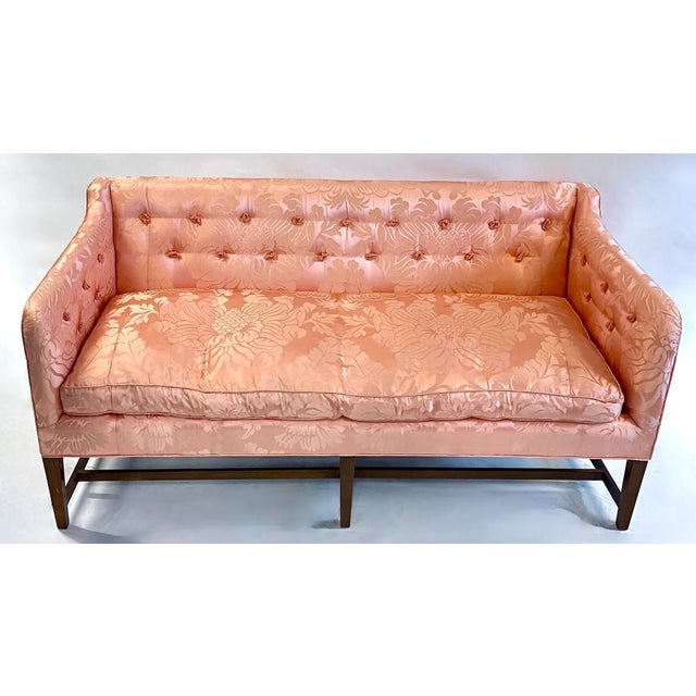 Vintage peach silk floral damask upholstered sofa with moss fringe style tufting. Tapered legs with stretchers between....