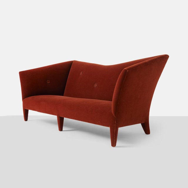 Spirit Sofa by John Hutton United States, c1990s A “spirit” sofa by John Hutton for Dohghia. Covered in a deep rust...