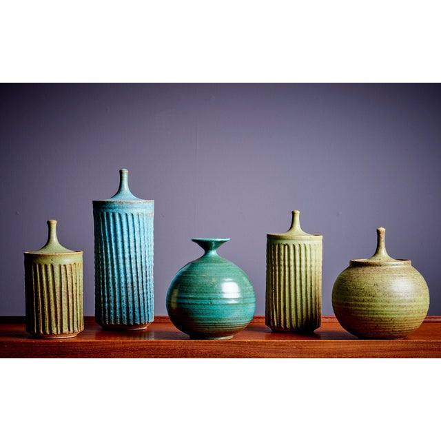 Tom McMillin Ceramic Vessels with lid and Vase in green, USA 1960s. The measurements given apply to the tallest vessel....