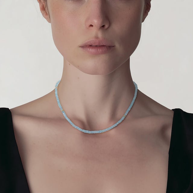 A whisper of ocean sky, crystallized, the Birthstone March Aquamarine Necklace captures the serene beauty of tranquil...