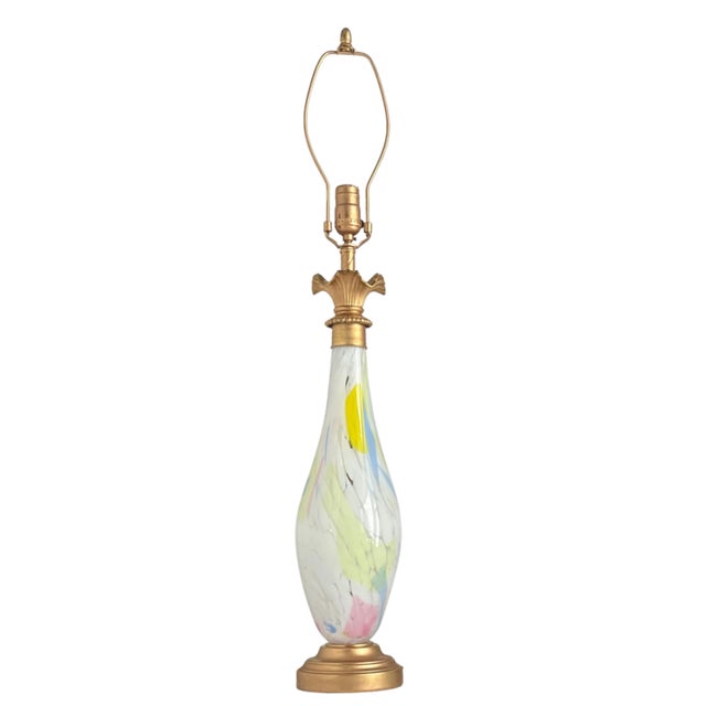 This 34-inch-tall lamp is a fusion of hand-blown Murano style glass and vintage brass-toned lamp parts to craft a refined,...
