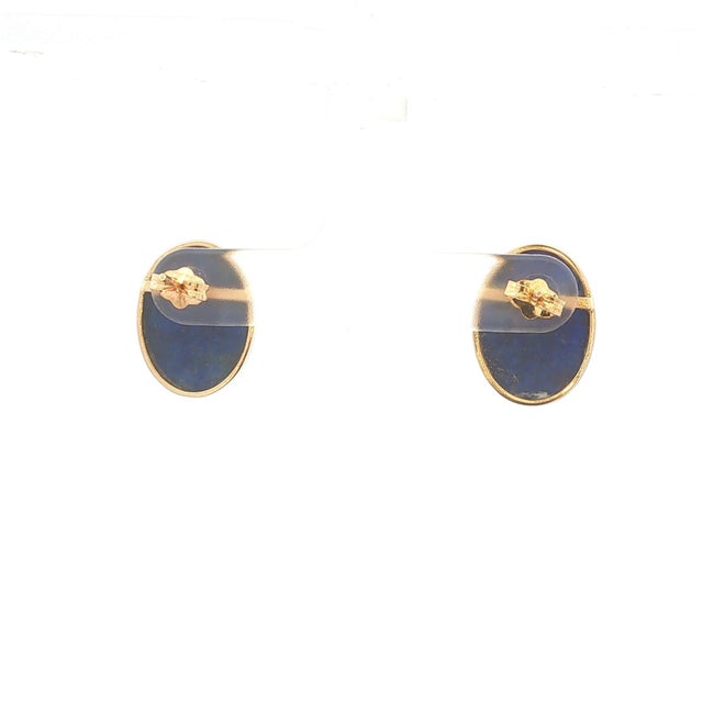 A pair of stud earrings featuring cabochon-cut Lapis Lazuli stones. These are oval shape stud earrings. They are mounted...
