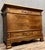 Napoleon III period walnut commode, circa 1850 Four drawers in the front Front panels, top and bottom drawers decorated...