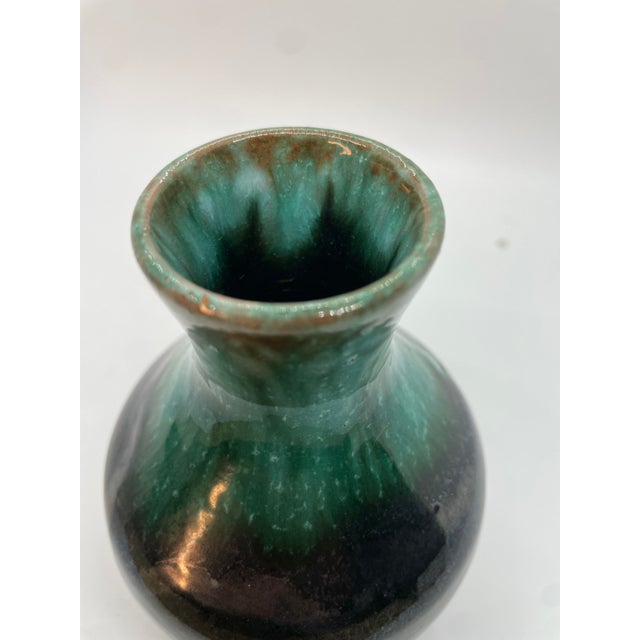 Discover the rustic elegance of this stunning Blue Mountain Pottery vase, boasting a captivating blend of brown and green...