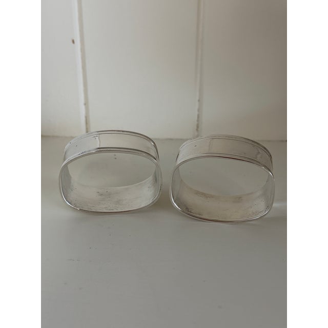 Add a charming French touch to the table with this vintage pair of silverplate napkin rings, beautifully engraved “Madame”...