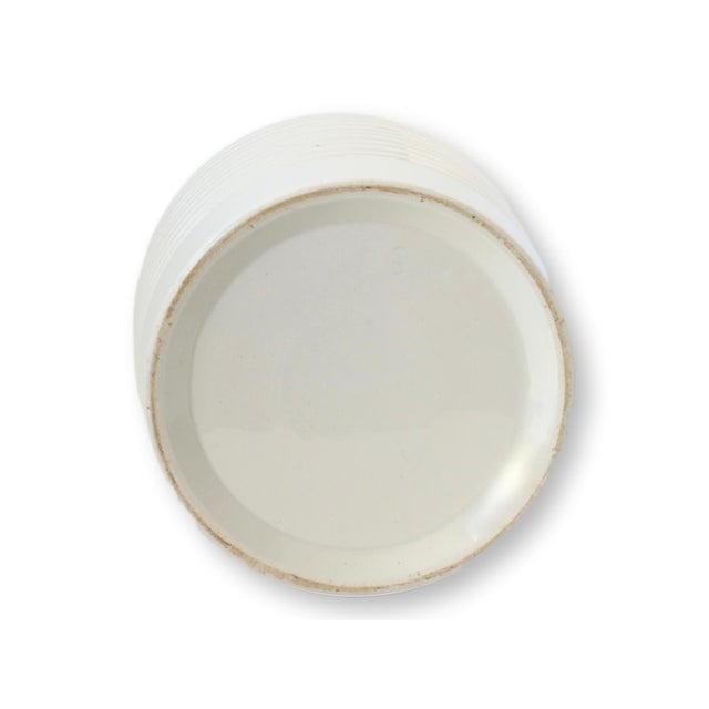 This Edwardian-era white ironstone canister features a banded design and bold "BARLEY" lettering. Retaining its original...