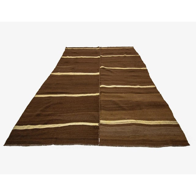 Vintage hand woven striped wool Kilim rug from Kars region of Turkey. Approximately 50-60 years old. In very good condition