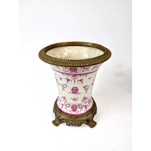 This is completely hand painted and no decals or transfers were used. Made of Porcelain with a brass stand.