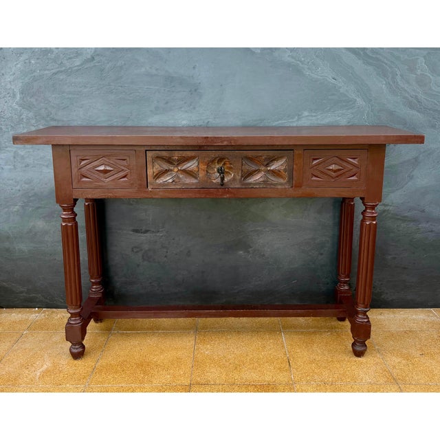 Elegant Spanish console table in the Renaissance Revival style, dating from the mid-20th century. Crafted in solid oak,...