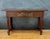 Elegant Spanish console table in the Renaissance Revival style, dating from the mid-20th century. Crafted in solid oak,...