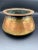 The Antique Hand Forged Omani Bedouin Copper Pot is a unique and intriguing piece that measures 7 1/2" x 3 1/2". This pot...