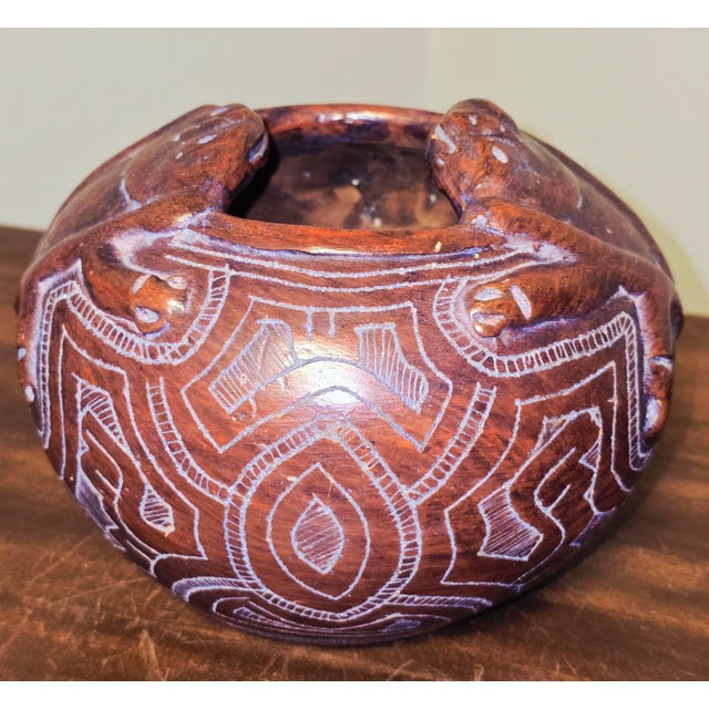 A handcrafted ceramic pot by Brazilian artist Reis Pará, created in the traditional Marajoara style of Marajó Island. The...